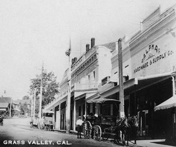 Old Postcard of Grass Valley, California showing the Alpha Building